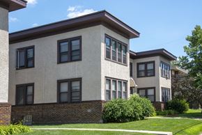 Minneapolis apartment for rent - a view of the exterior of two buildings on a sunny day