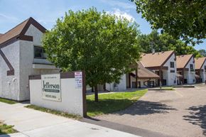 Minneapolis apartment for rent - a group of houses in a neighborhood with a sign in front of it
