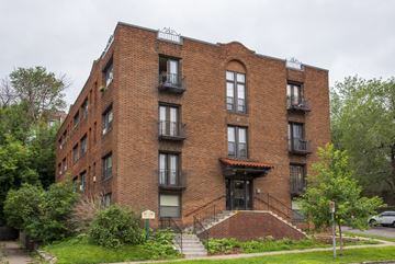 Saint Paul apartment for rent - a red brick apartment building with stairs and a sidewalk