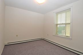 Hibbing apartment for rent - a bedroom with white walls and a window