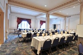 Hibbing apartment for rent - a conference room filled with tables and chairs and a projection screen