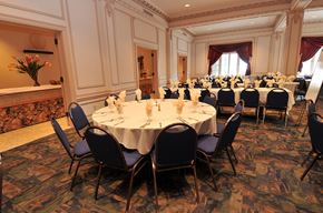 Hibbing apartment for rent - a dining room with tables and chairs in a conference room
