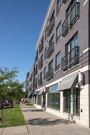 Minneapolis apartment for rent - a large brick building with a sidewalk in front of it