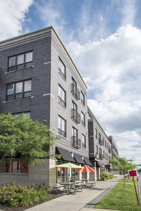 Minneapolis apartment for rent - a tall building with a sidewalk in front of it
