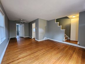 Munster house for rent - an empty living room with a hard wood floor and a staircase