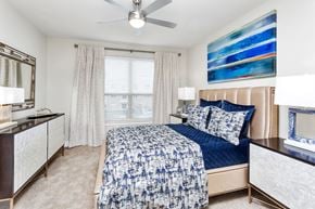 Lakewood apartment for rent - Westwood Green Apartments Master bedroom with wall to wall carpet, ceiling fan and large windows