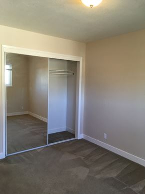 San Jose apartment for rent - a bedroom with a closet and a floor to ceiling mirror
