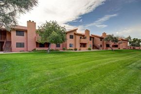 Chandler apartment for rent - A large house with a green lawn in front.