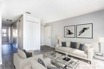 Redlands apartment for rent - A living room with a white couch and a coffee table.