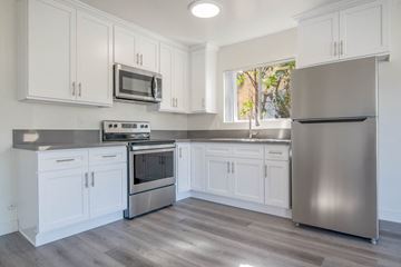 Los Angeles apartment for rent - a kitchen with white cabinets and stainless steel appliances