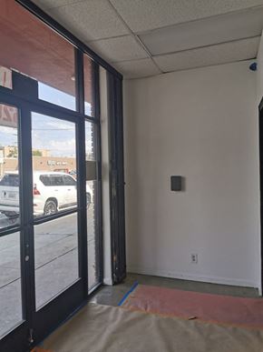 North Hollywood apartment for rent - A room with a white wall and a door with a window.