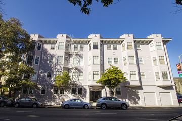 San Francisco apartment for rent - A white building with a tree in front of it.
