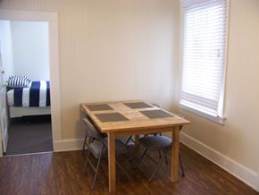 Santa Barbara apartment for rent - A table with four chairs is in a room with a window.