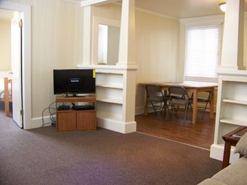 Santa Barbara apartment for rent - A living room with a television and a chair.