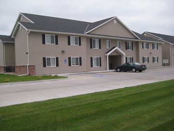Kearney apartment for rent - a large building with a car parked in front of it