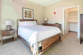 Livonia apartment for rent - a bedroom with a bed and a closet