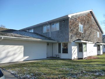 Kearney apartment for rent - the front of a white house with a gray roof