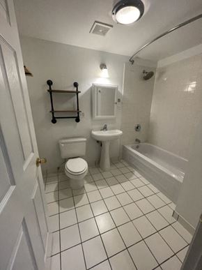 Chicago apartment for rent - a bathroom with a toilet sink and a bath tub