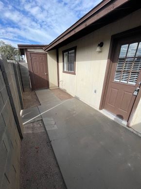 Mesa apartment for rent - A brown door is on the right side of a house.
