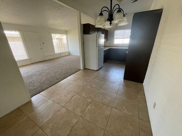 Mesa apartment for rent - A kitchen area with a refrigerator and a countertop.