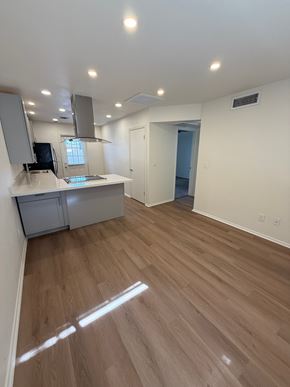 Mesa apartment for rent - A room with wooden flooring and a kitchenette.