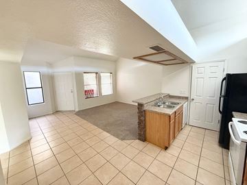 Mesa apartment for rent - A kitchen area with a sink and a refrigerator.