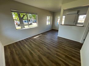 Mesa apartment for rent - a living room with a hard wood floor and a large window