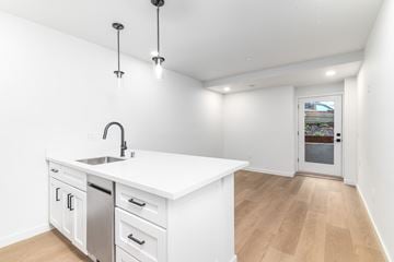 San Francisco apartment for rent - A kitchen with white cabinets and a white counter top.