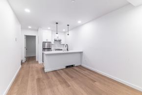 San Francisco apartment for rent - A kitchen with a refrigerator, sink, and cabinets.