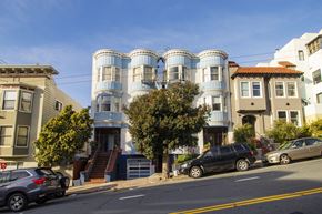 San Francisco apartment for rent - A row of houses with a car parked in front of them.
