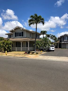 Kapolei house for rent - A house with a white van parked in front.
