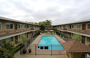 Hayward apartment for rent - A pool in the middle of apartment buildings.