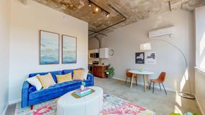 Albany apartment for rent - a living room with a blue couch and a table
