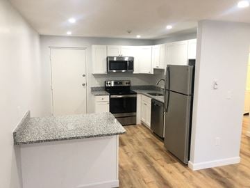 Quincy apartment for rent - a renovated kitchen with granite counter tops and stainless steel appliances