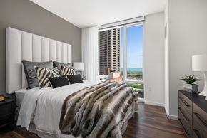 Chicago apartment for rent - Furnished bedroom with floor to ceiling windows at Eleven40, Chicago