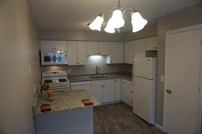 St. Louis Park apartment for rent - full kitchen with granite counter tops and white cabinets