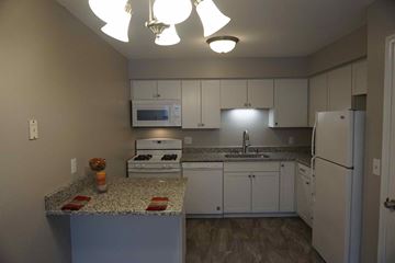 St. Louis Park apartment for rent - full kitchen with granite counter tops and white cabinets