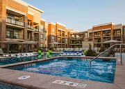 Overland Park apartment for rent - An outdoor pool at an apartment home complex at The Apex at CityPlace, Overland Park, KS