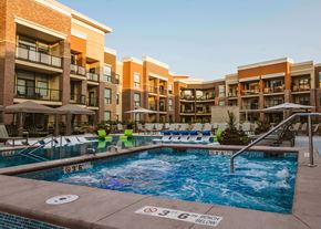 Overland Park apartment for rent - An outdoor pool at an apartment home complex at The Apex at CityPlace, Overland Park, KS
