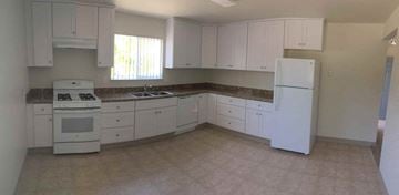 Hollister apartment for rent - A kitchen with white cabinets and appliances.