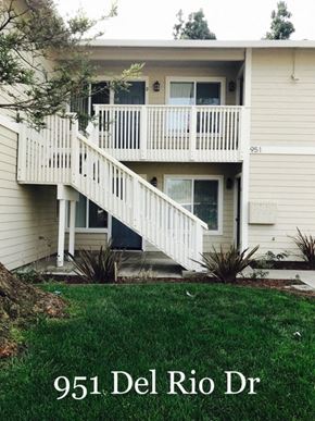 Hollister apartment for rent - A two-story house with a balcony and stairs leading to the second floor.