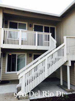 Hollister apartment for rent - A white deck with a staircase leading to a door with a window above it.