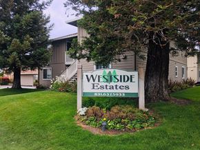 Hollister apartment for rent - A sign for Wes Side Estates in front of a building.