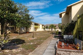 Tarpon Springs apartment for rent - A residential area with houses and a playground.
