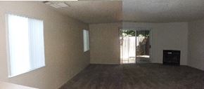 Gilroy apartment for rent - an empty living room with a fireplace and a door