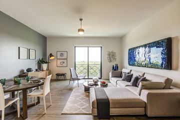 Coral Gables apartment for rent - a living room with a couch and a dining room table