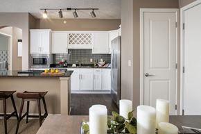 Omaha apartment for rent - A kitchen with a counter and bar stools.