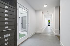 San Francisco apartment for rent - A long hallway with mailboxes on the wall.