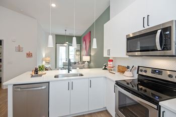 Contemporary open kitchens featuring stainless steel appliances