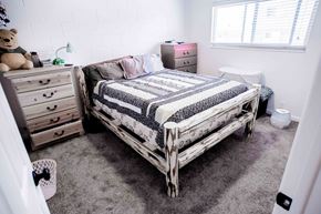 Provo apartment for rent - a bedroom with a bed and dressers in it